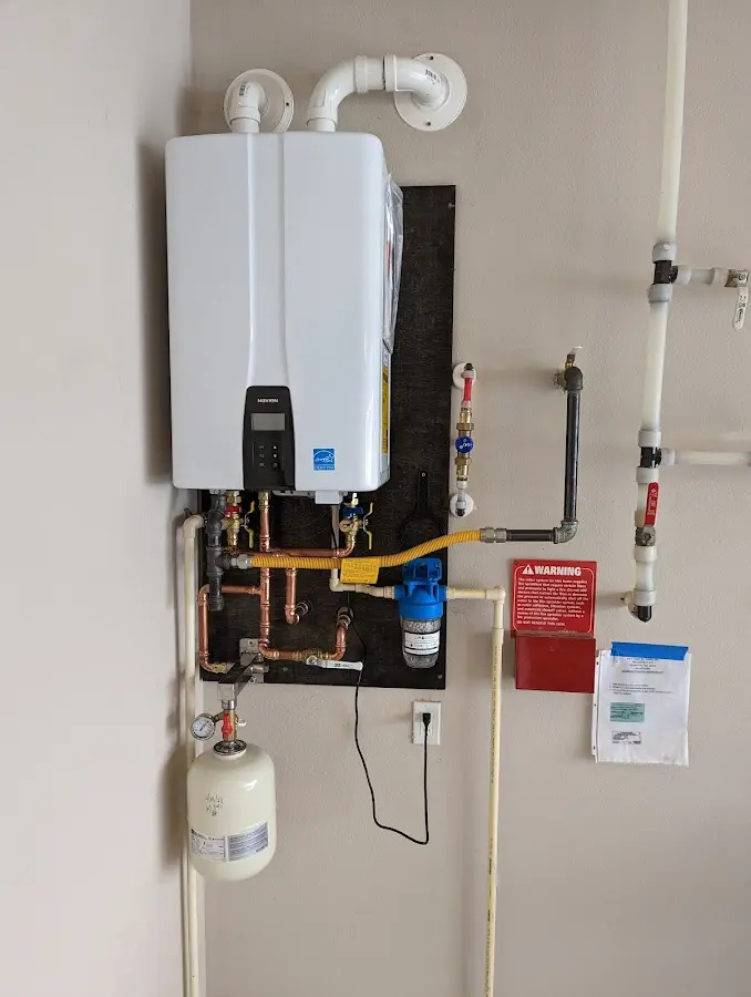 Professional plumber installing copper piping in a Fort Stockton home